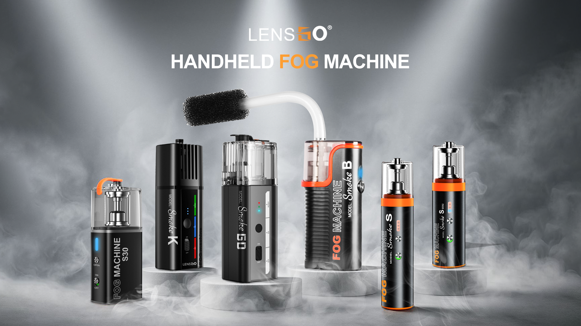 Lensgo Smoke GO Six Lensgo Smoke GO handheld fog machines are displayed on white cylindrical pedestals, emitting a smoky effect, against a dark background. The machines vary in size and color, with some showing clear reservoirs and others with opaque designs. The text