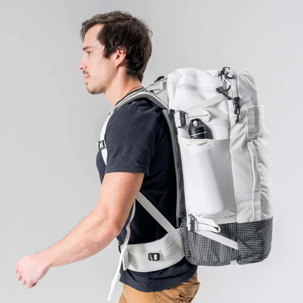 side view of a man with a matador globe rider 45 bakpack.
