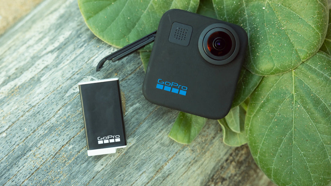 GoPro camera and battery on a leafy background