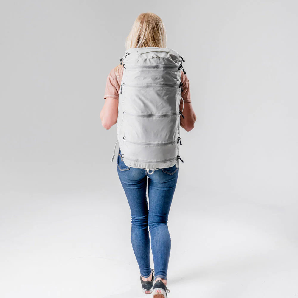 A girl carring Matador SEG45 Travel Pack