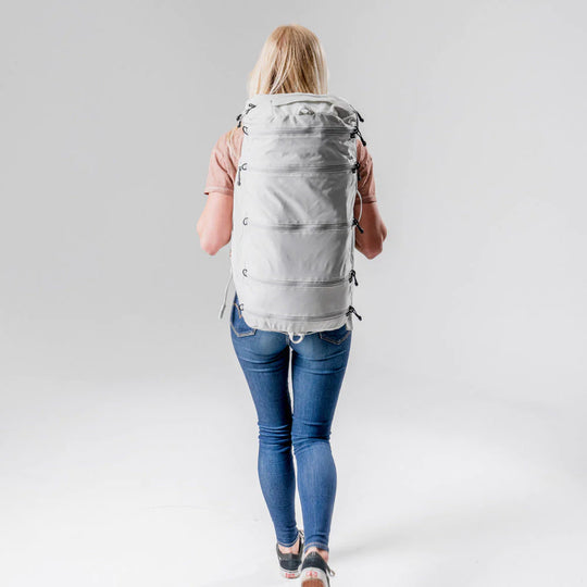A girl carring Matador SEG45 Travel Pack