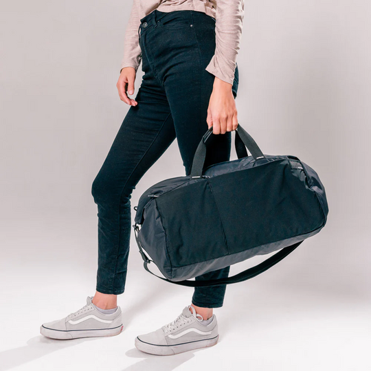 A model holding Matador ReFraction Packable Duffle bag