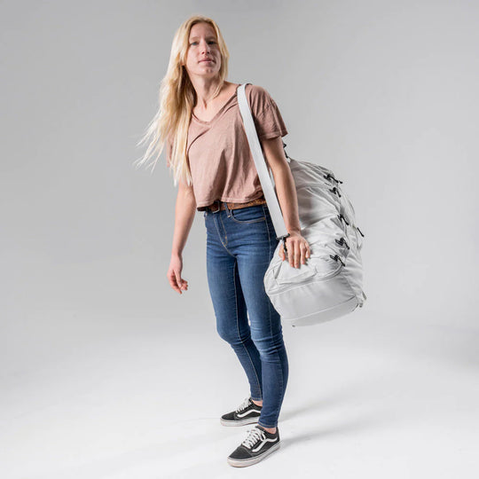 Liffestyle image of a girl with white matador SEG45 Travel Pack