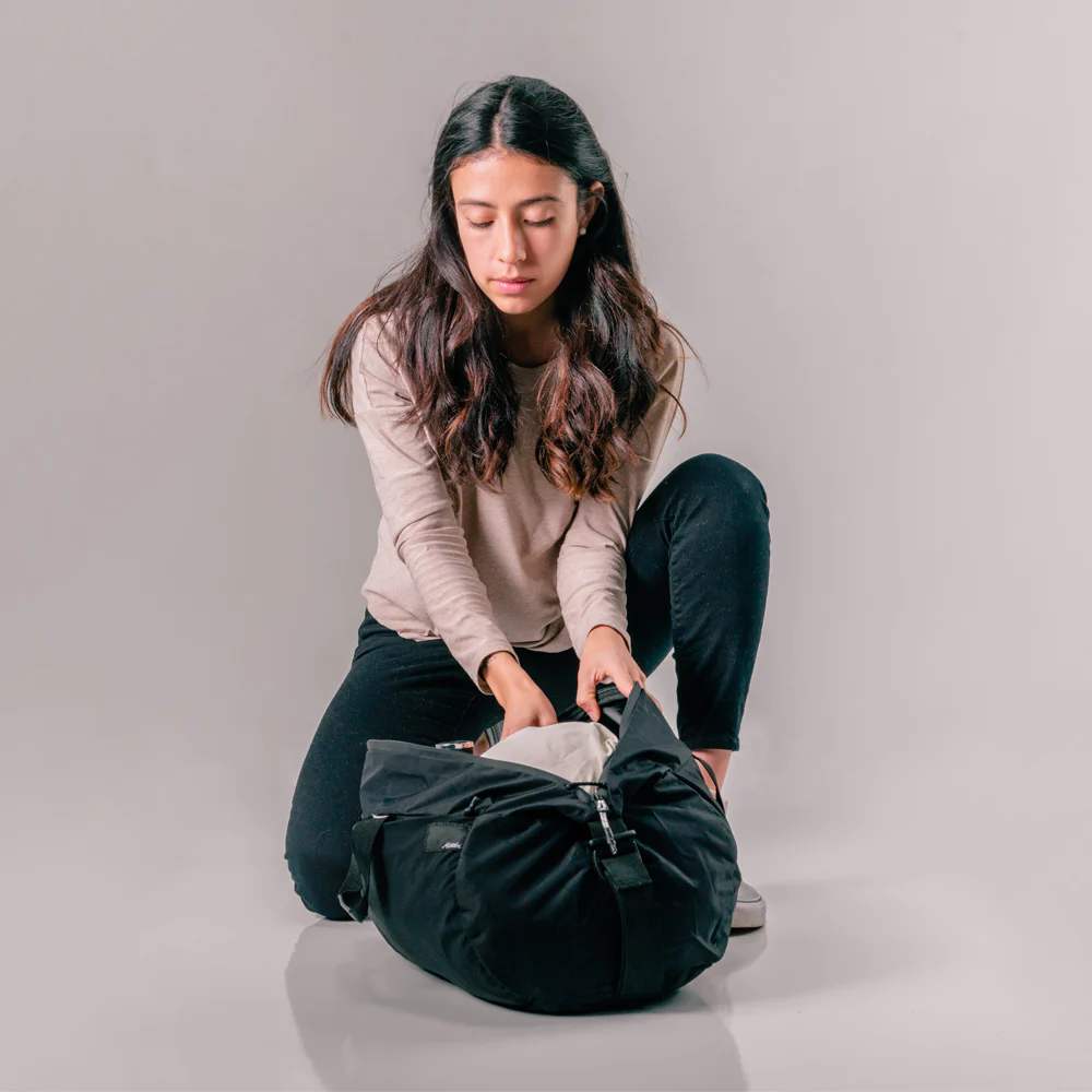 A model with Matador ReFraction Packable Duffle bag