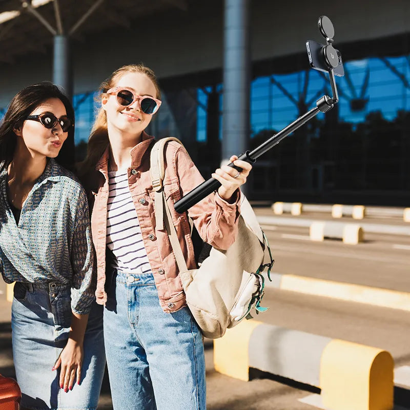 Two women taking selfie with Ulanzi MG-002 Magnetic Tripod/Selfie Stick