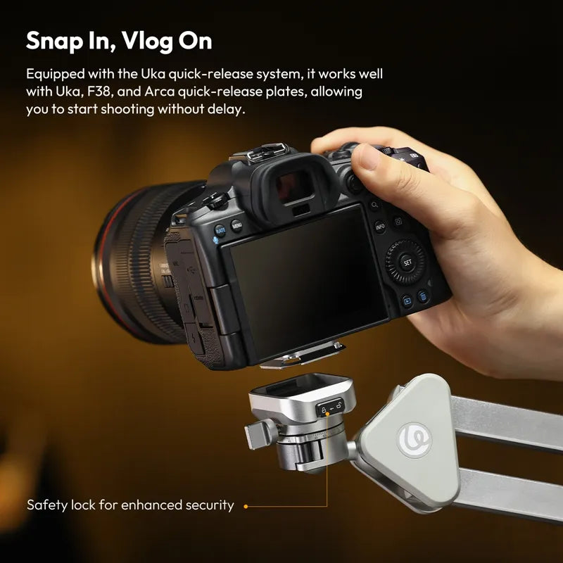 Camera with quick-release system held by a hand on a blurred background
