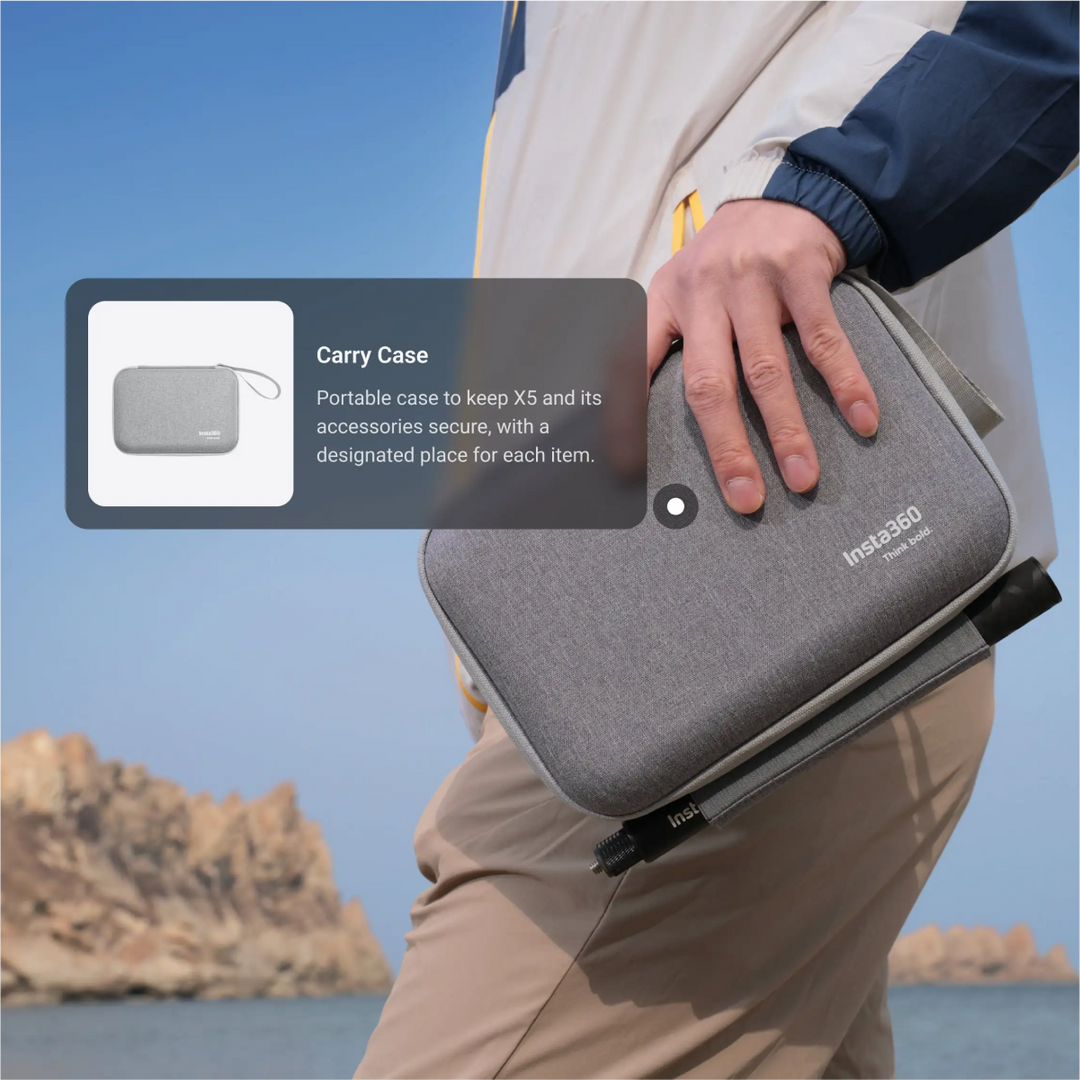 Person holding a gray carry case with 'Insta360' branding against a scenic background.