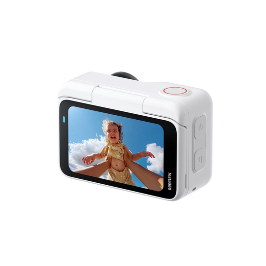 White action camera displaying a child playing on a beach with blue sky and clouds.