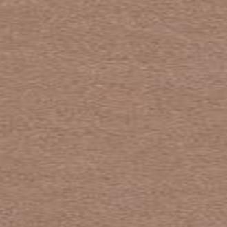 A close-up view of a beige seamless background paper used for studio photography.