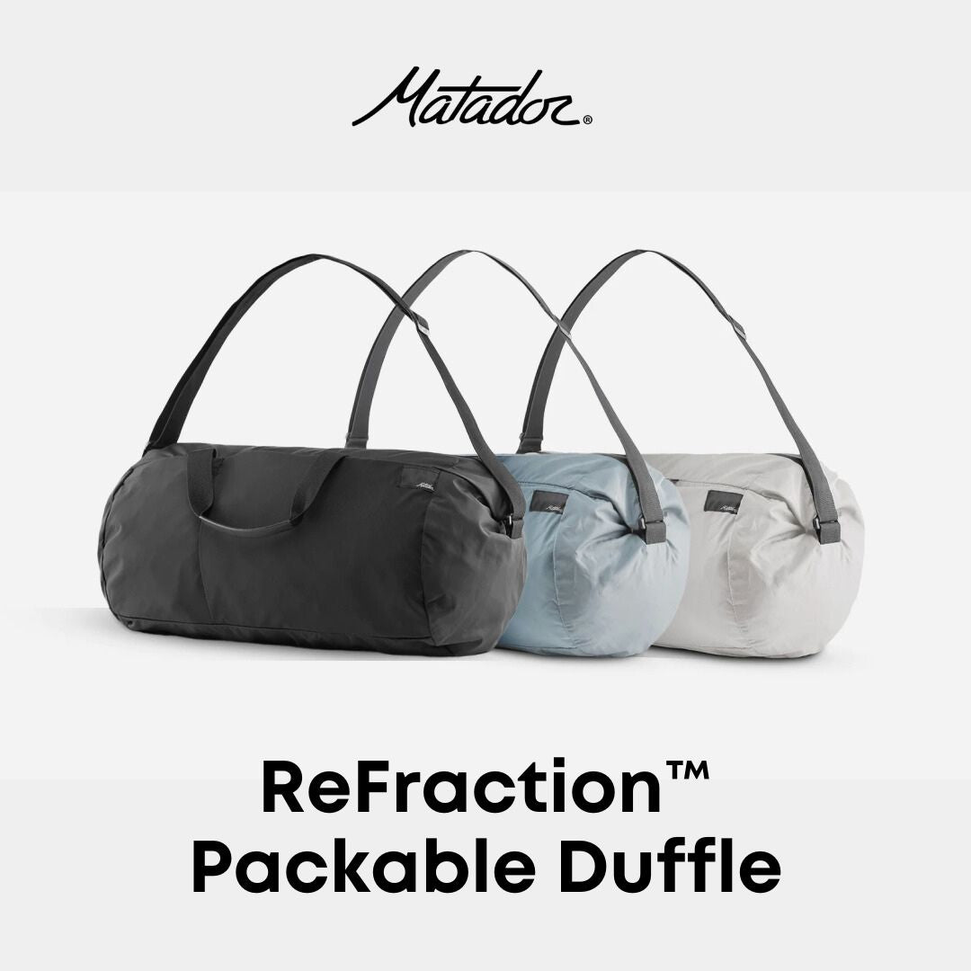 Three Matador ReFraction Packable Duffle bags, one in black and one in blue, one in white displayed against a white background with the brand name visible at the top.